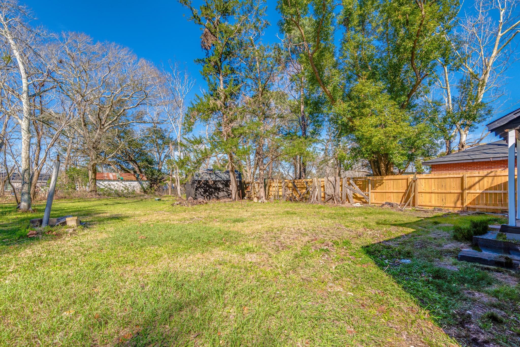 1105 North Valderas Street Angleton, TX 77515 - Photo 14 of 17 a view of a yard with a house