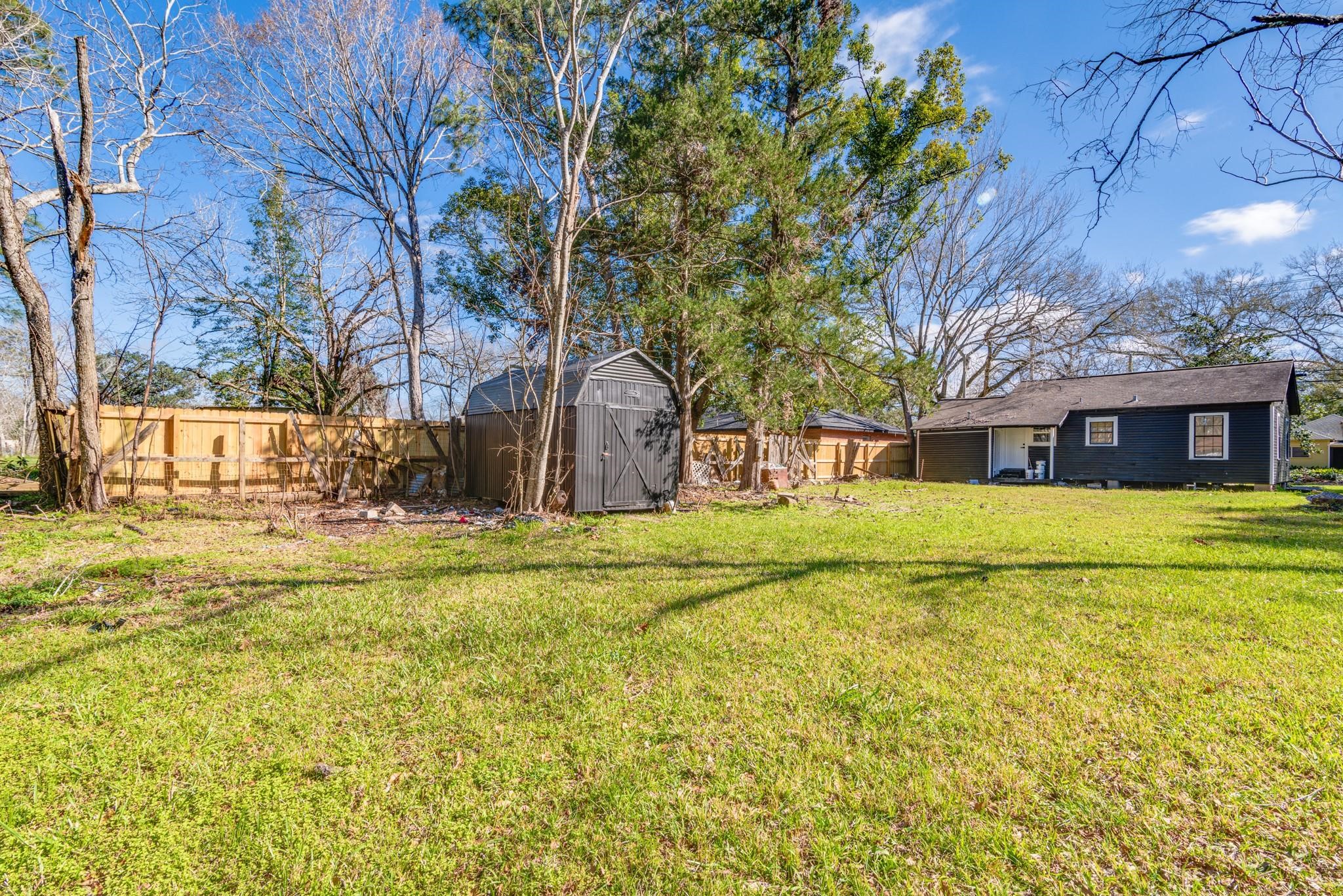 1105 North Valderas Street Angleton, TX 77515 - Photo 15 of 17 a front view of a house with a yard