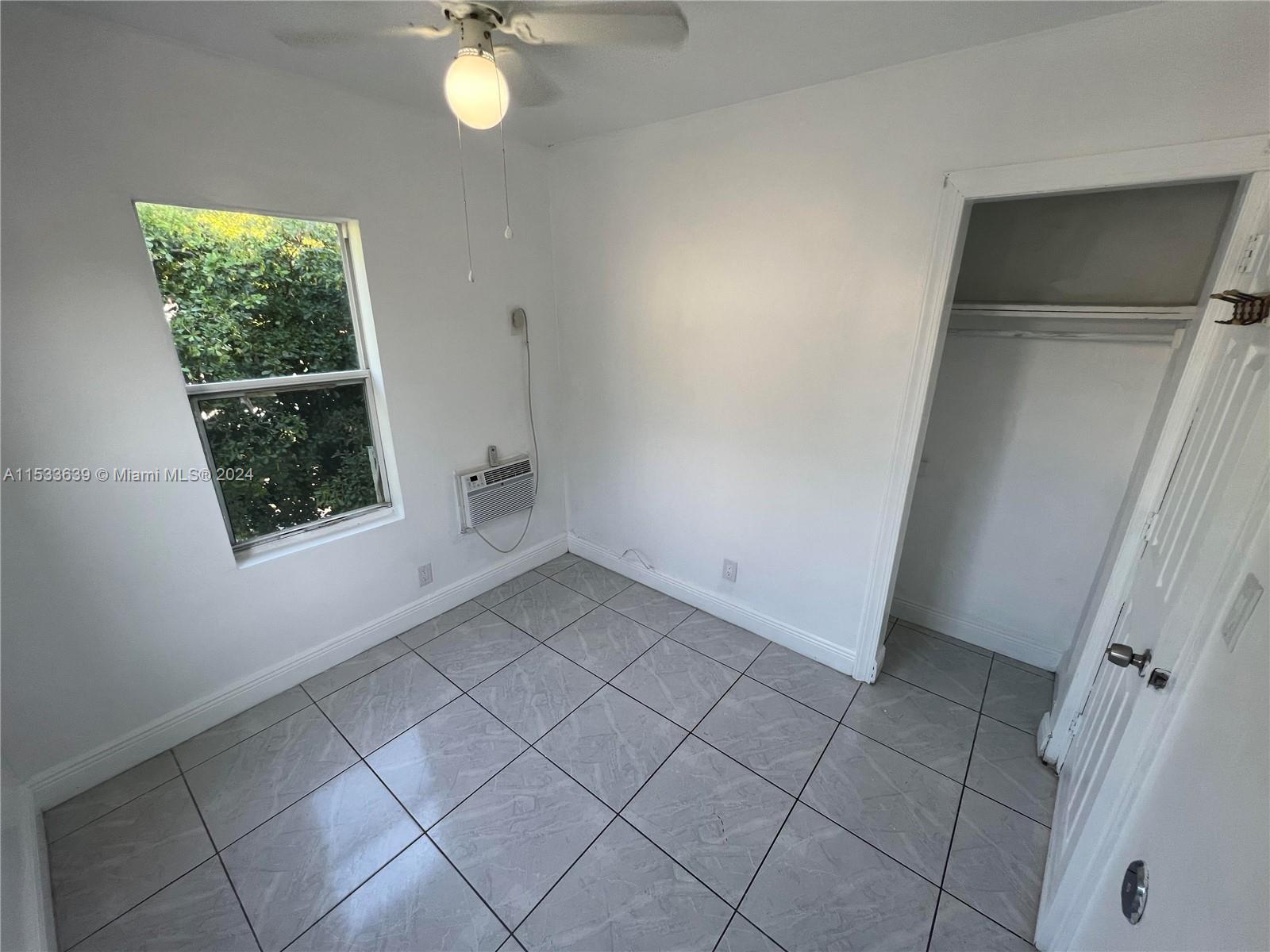 1935 Southwest 2nd Street, Unit 2 Miami, FL 33135 - Photo 10 of 12 a view of an empty room with a window