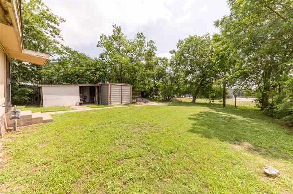 a house with swimming pool in front of it