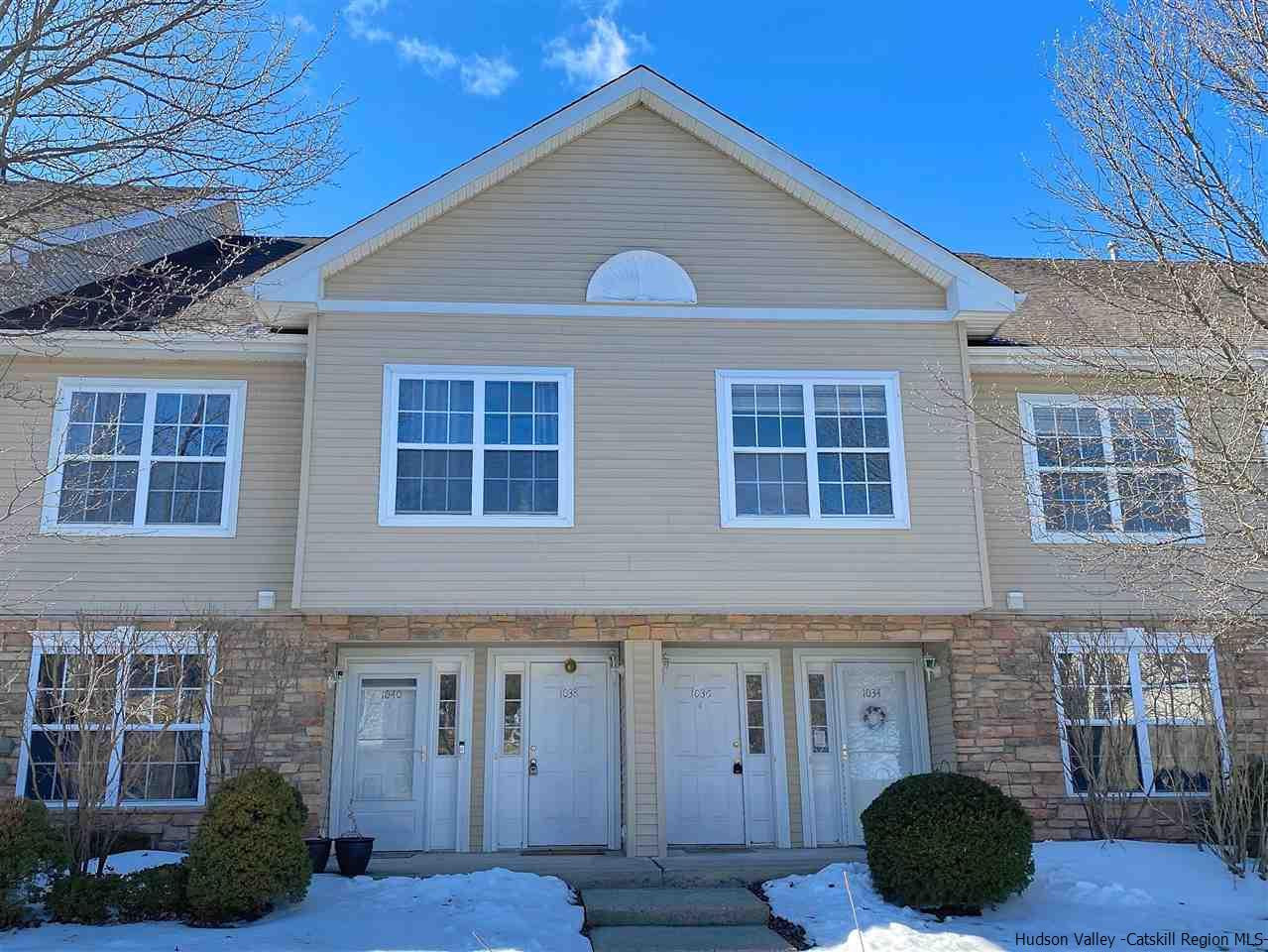 1036 Maggie Road, Unit 148 Newburgh, NY 12550 - Photo 1 of 19 a front view of a house with a yard