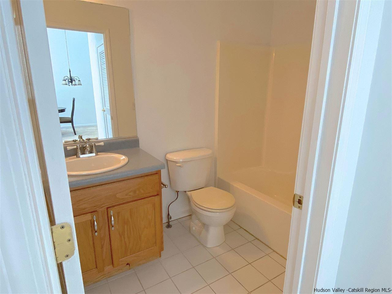 1036 Maggie Road, Unit 148 Newburgh, NY 12550 - Photo 11 of 19 a bathroom with a sink and a toilet
