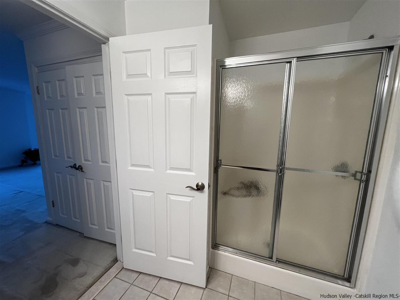 1036 Maggie Road, Unit 148 Newburgh, NY 12550 - Photo 16 of 19 a bathroom with a glass shower door
