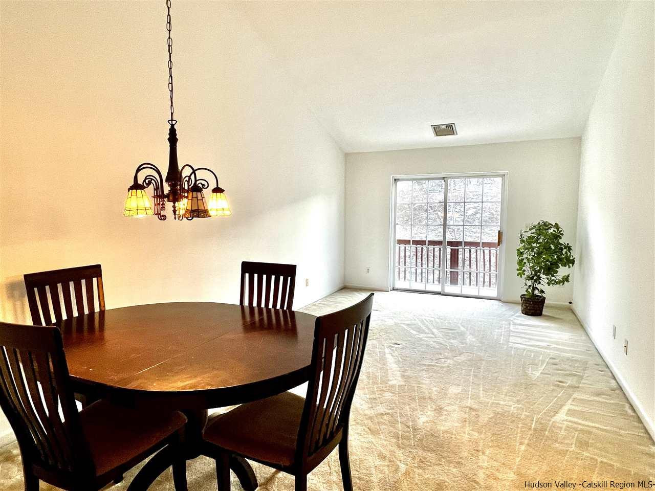 1036 Maggie Road, Unit 148 Newburgh, NY 12550 - Photo 7 of 19 a view of a dining room with furniture and window