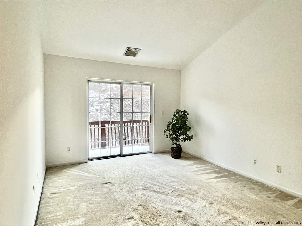 1036 Maggie Road, Unit 148 Newburgh, NY 12550 - Photo 8 of 19 a view of an empty room with a window