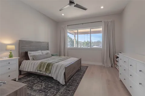 a bedroom with furniture and a window