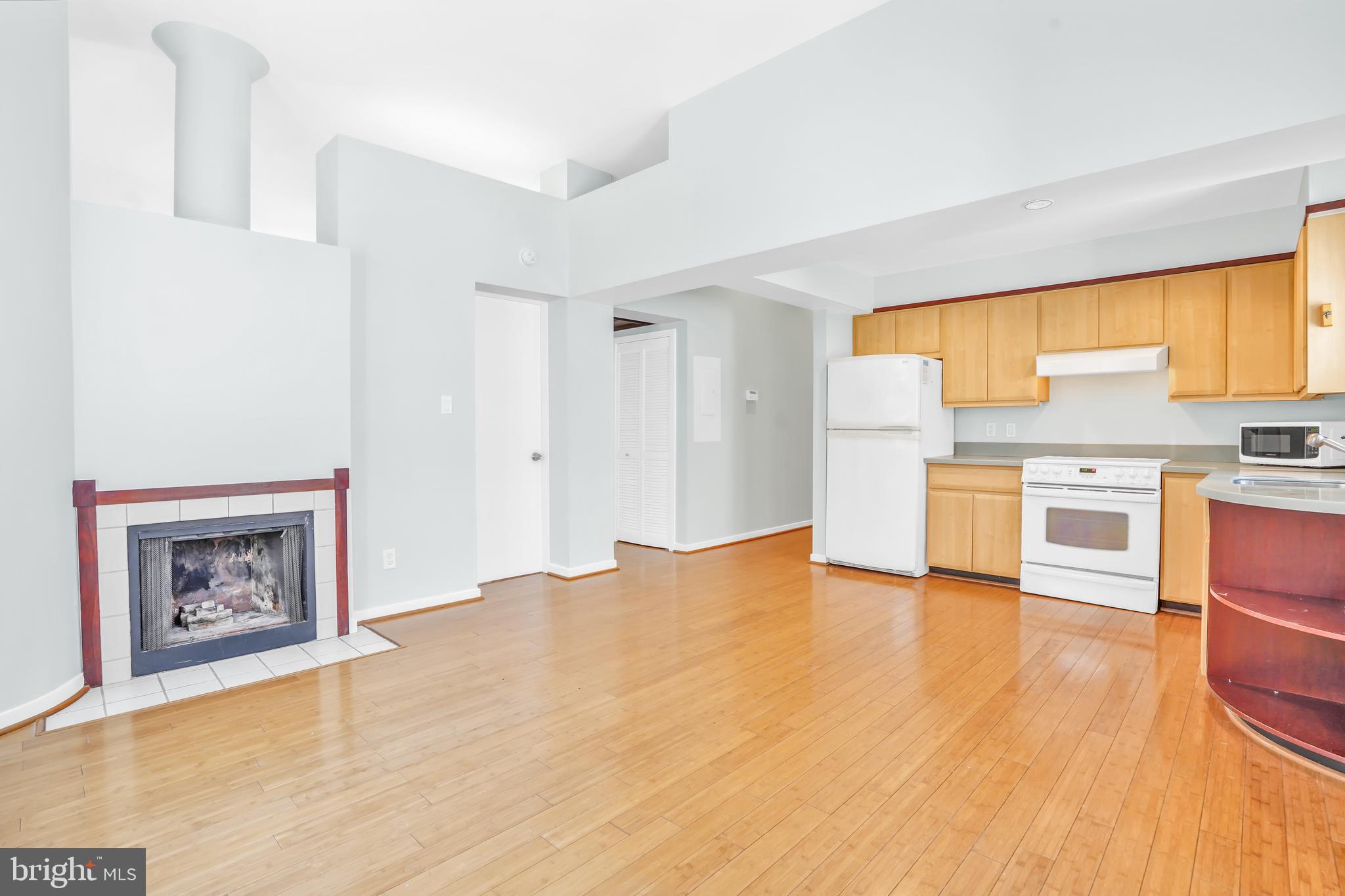 2114 N Street Northwest, Unit 46 Washington, DC 20037 - Photo 14 of 26 a view of kitchen with wooden floor and electronic appliances