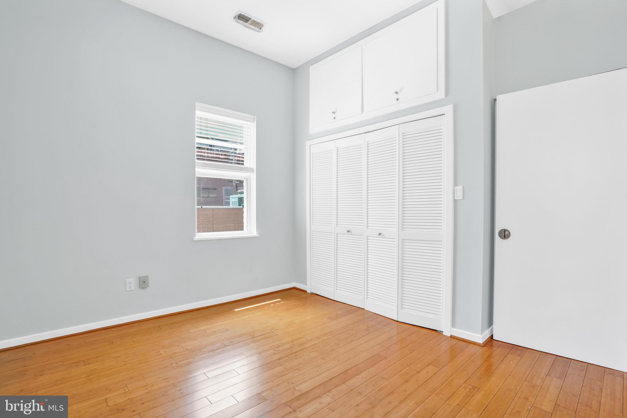 2114 N Street Northwest, Unit 46 Washington, DC 20037 - Photo 16 of 26 a view of empty room with wooden floor