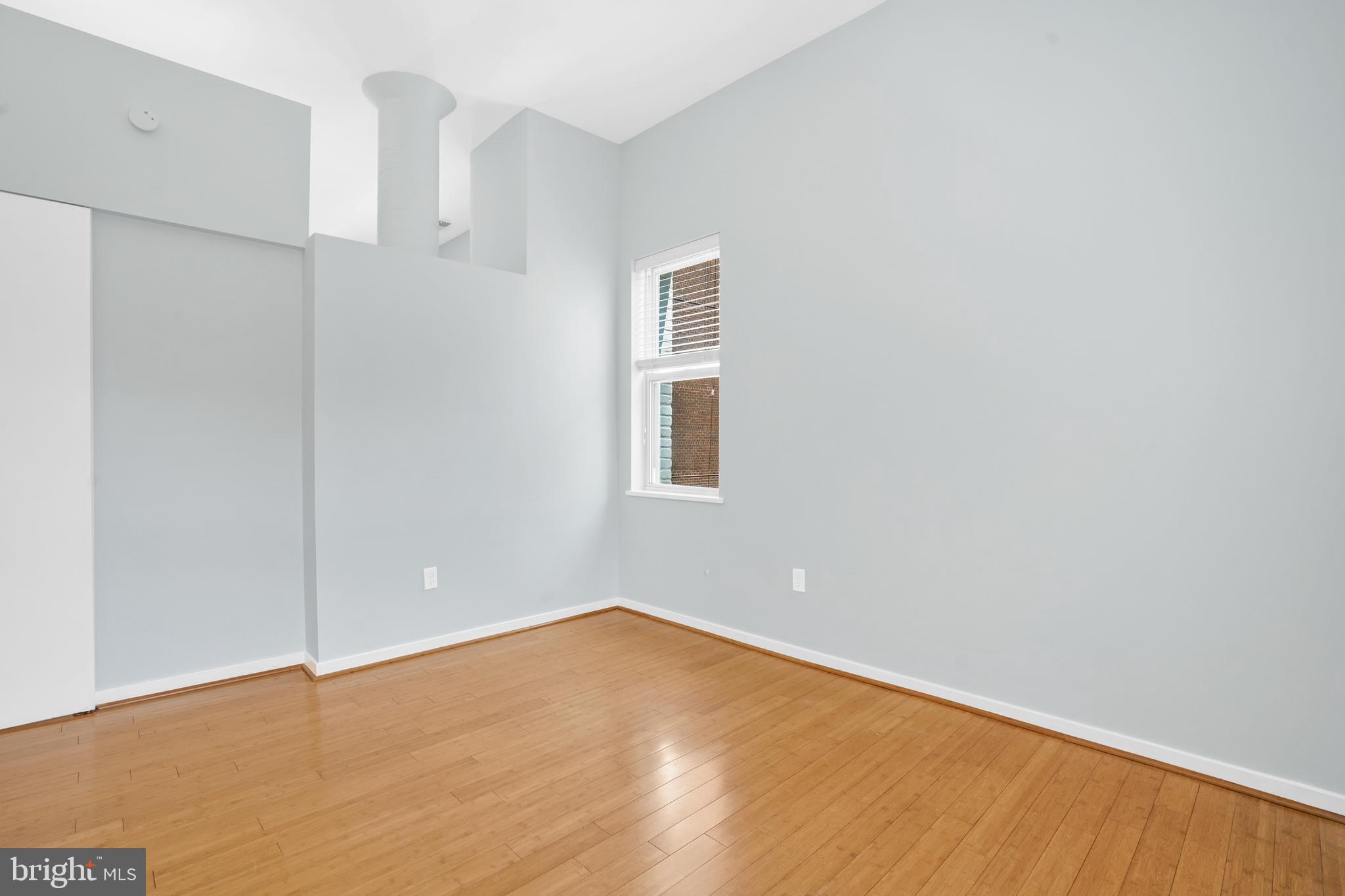 2114 N Street Northwest, Unit 46 Washington, DC 20037 - Photo 19 of 26 a view of an empty room with wooden floor