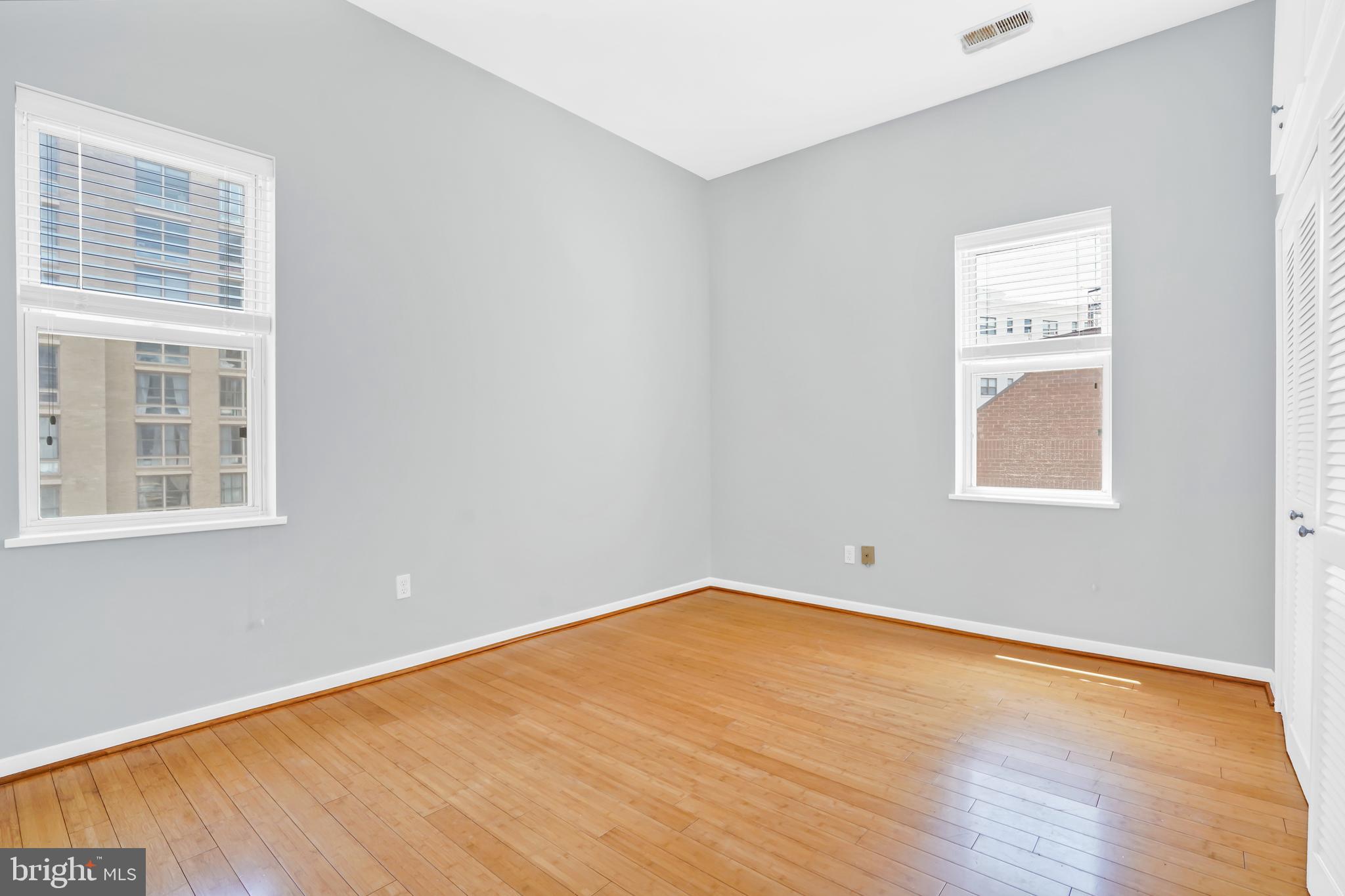 2114 N Street Northwest, Unit 46 Washington, DC 20037 - Photo 20 of 26 a view of a room with wooden floor and windows