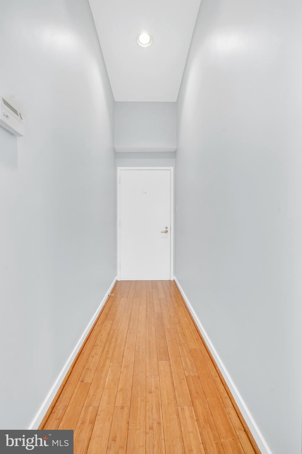 2114 N Street Northwest, Unit 46 Washington, DC 20037 - Photo 4 of 26 a view of empty room with wooden floor