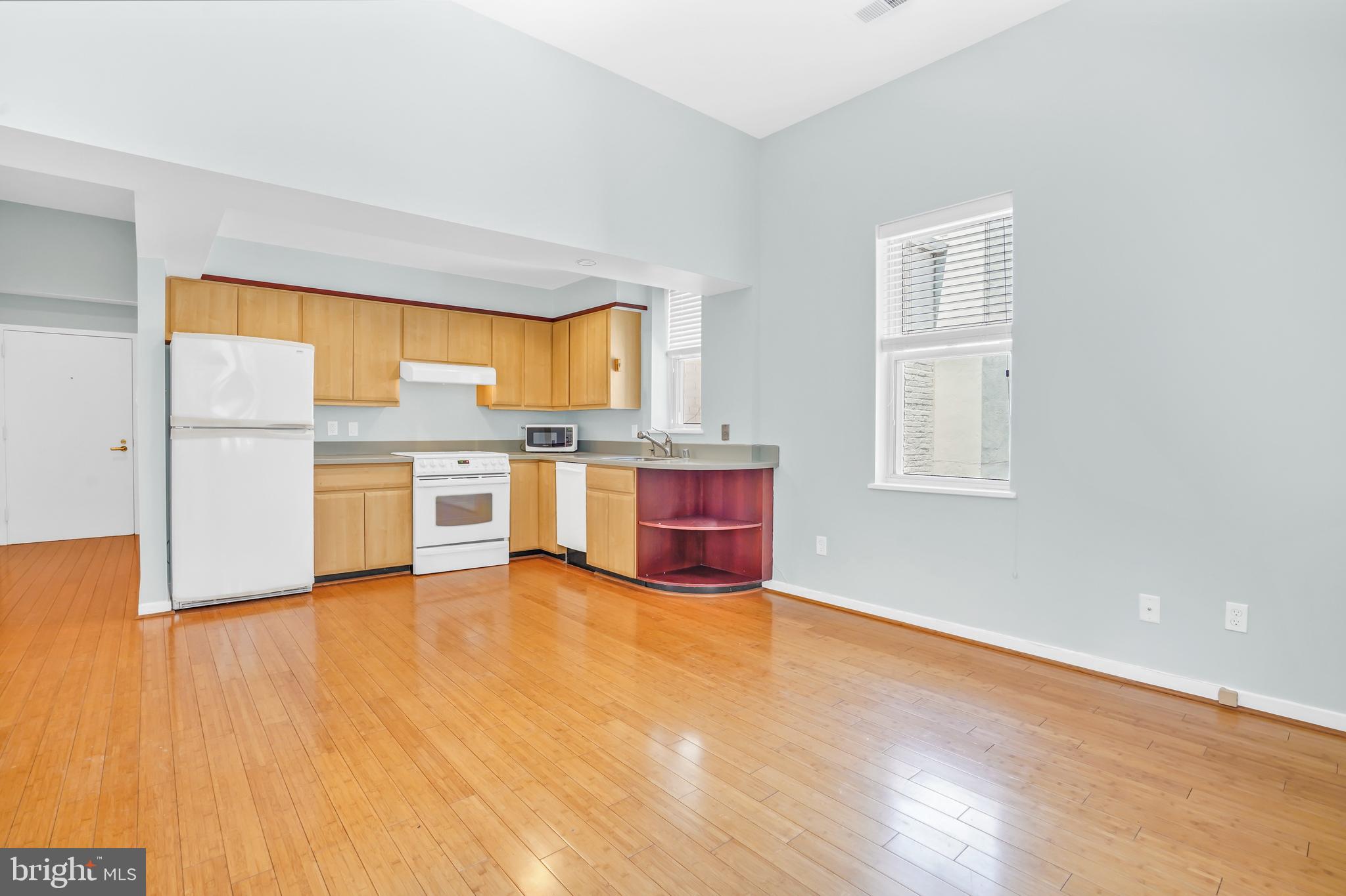 2114 N Street Northwest, Unit 46 Washington, DC 20037 - Photo 9 of 26 a view of kitchen with stainless steel appliances wooden floor and a window