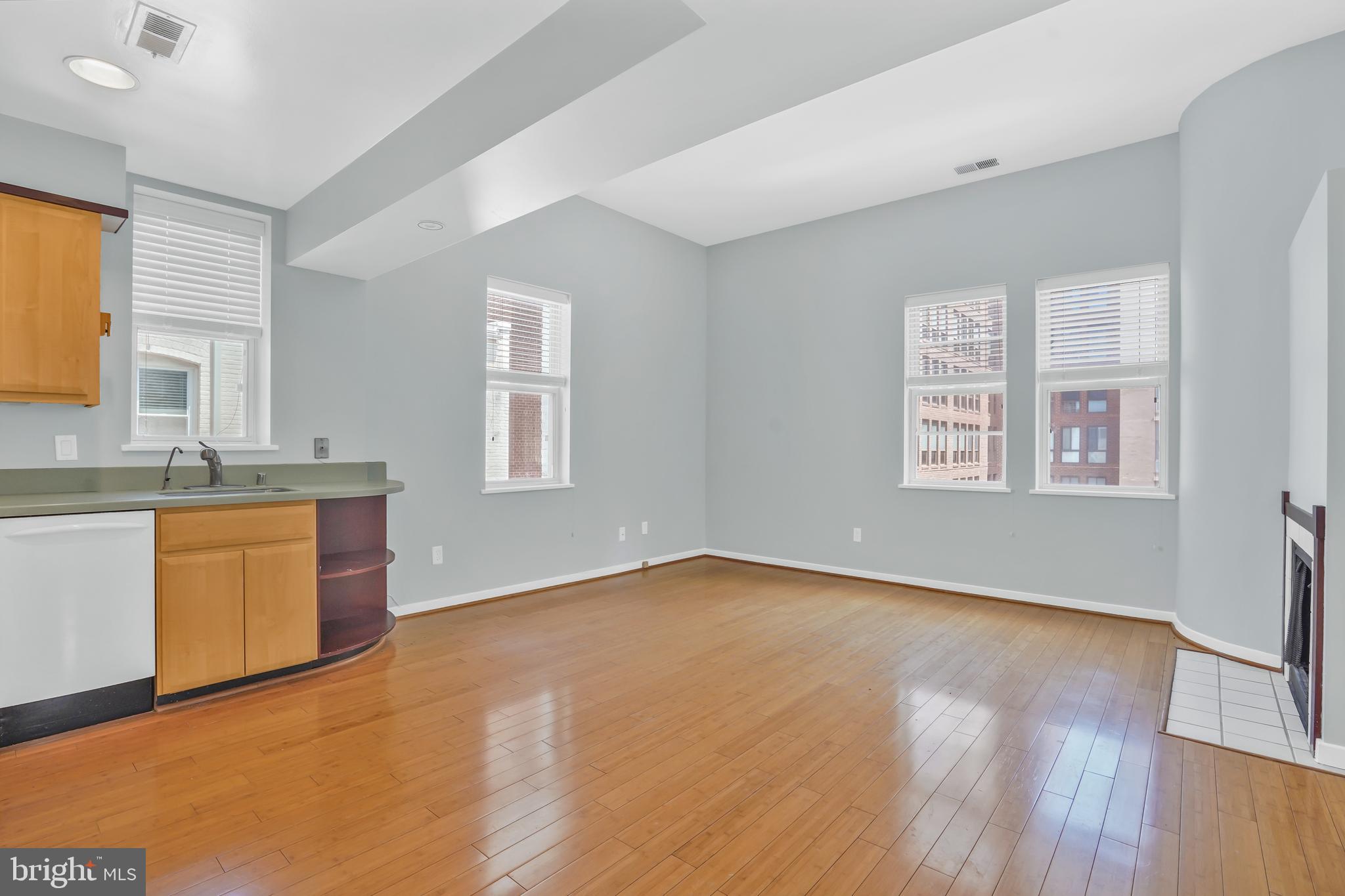 2114 N Street Northwest, Unit 46 Washington, DC 20037 - Photo 10 of 26 wooden floor in an empty room with a window and wooden floor