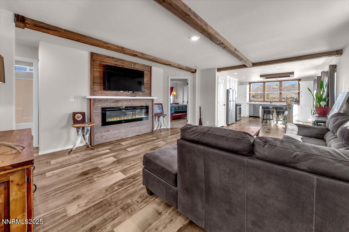 195 Muletail Circle Reno, NV 89508 - Photo 3 of 44 a living room with fireplace furniture and a flat screen tv