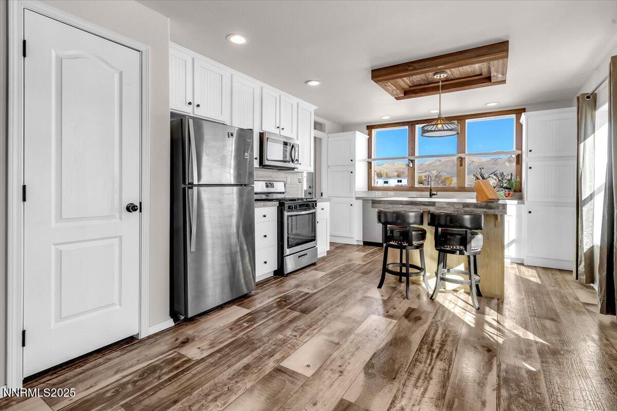 195 Muletail Circle Reno, NV 89508 - Photo 7 of 44 a kitchen with stainless steel appliances a refrigerator and a stove top oven
