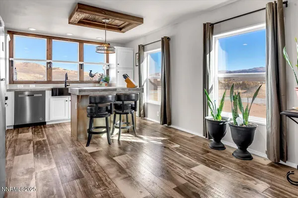 a view of a dining room with furniture window and outside view