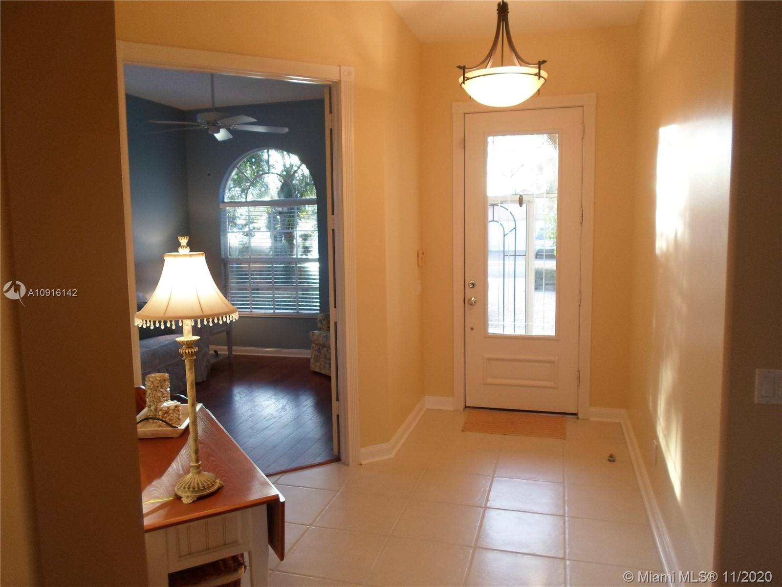 10889 Southwest Candlewood Road Port St. Lucie, FL 34987 - Photo 4 of 13 Foyer & Front Den