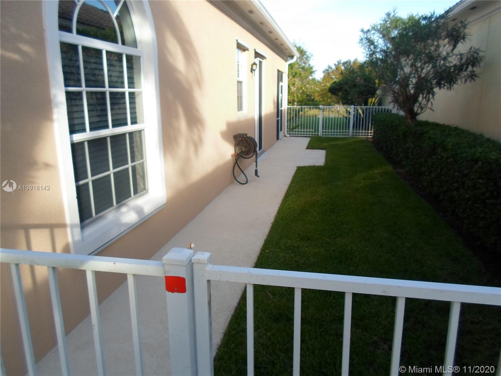 10889 Southwest Candlewood Road Port St. Lucie, FL 34987 - Photo 10 of 13 Fenced Side Yard