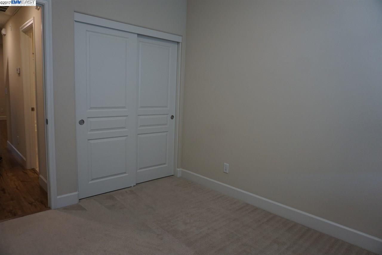 4728 Norris Canyon Road, Unit 205 San Ramon, CA 94583 - Photo 12 of 18 wooden floor and cabinet in an empty room