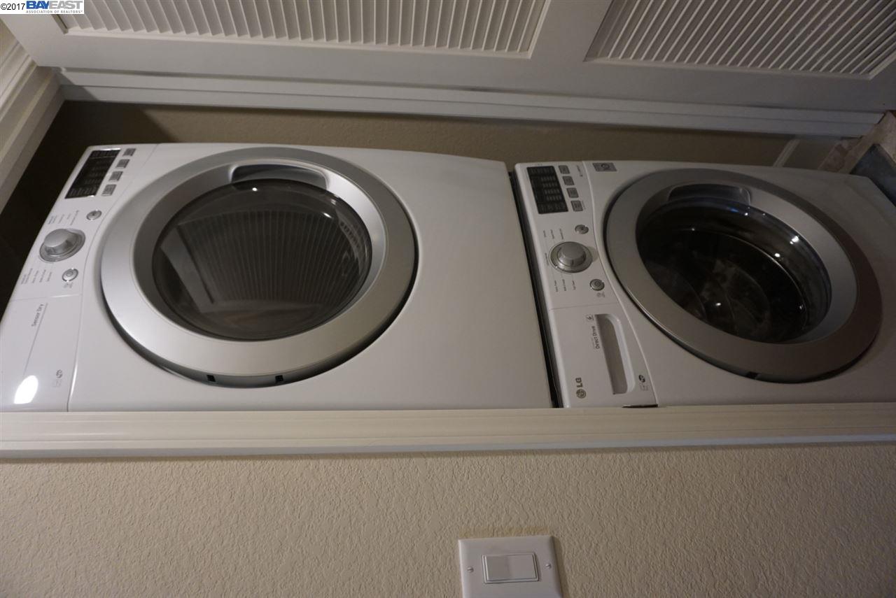 4728 Norris Canyon Road, Unit 205 San Ramon, CA 94583 - Photo 17 of 18 a utility room with dryer and washer