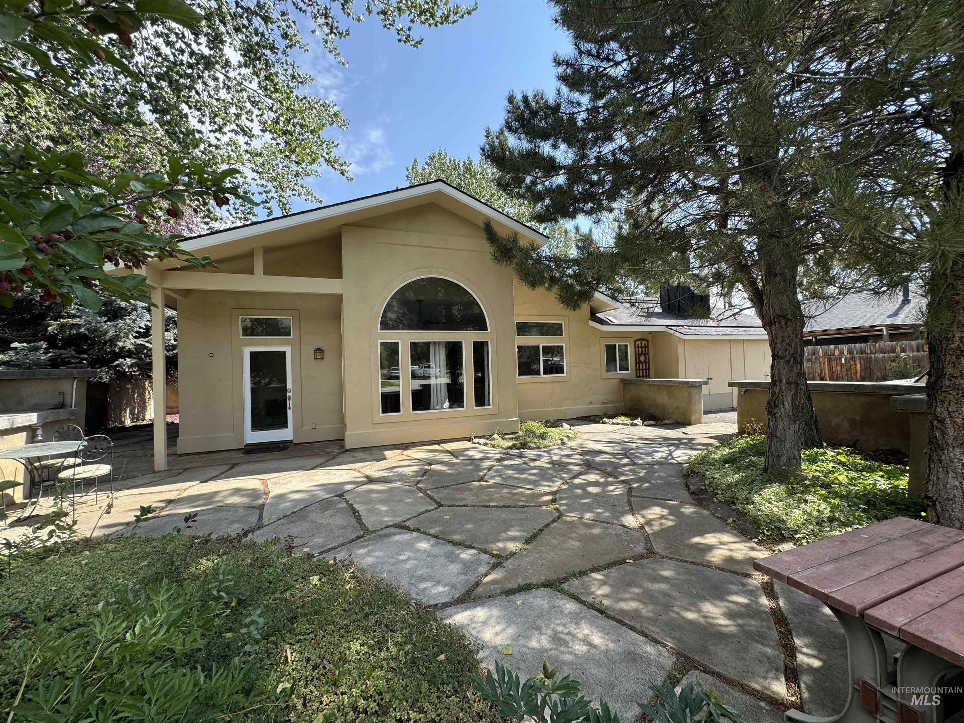 Enjoy private walled stone patio  with firepit and mountain views. Mature trees & landscape.