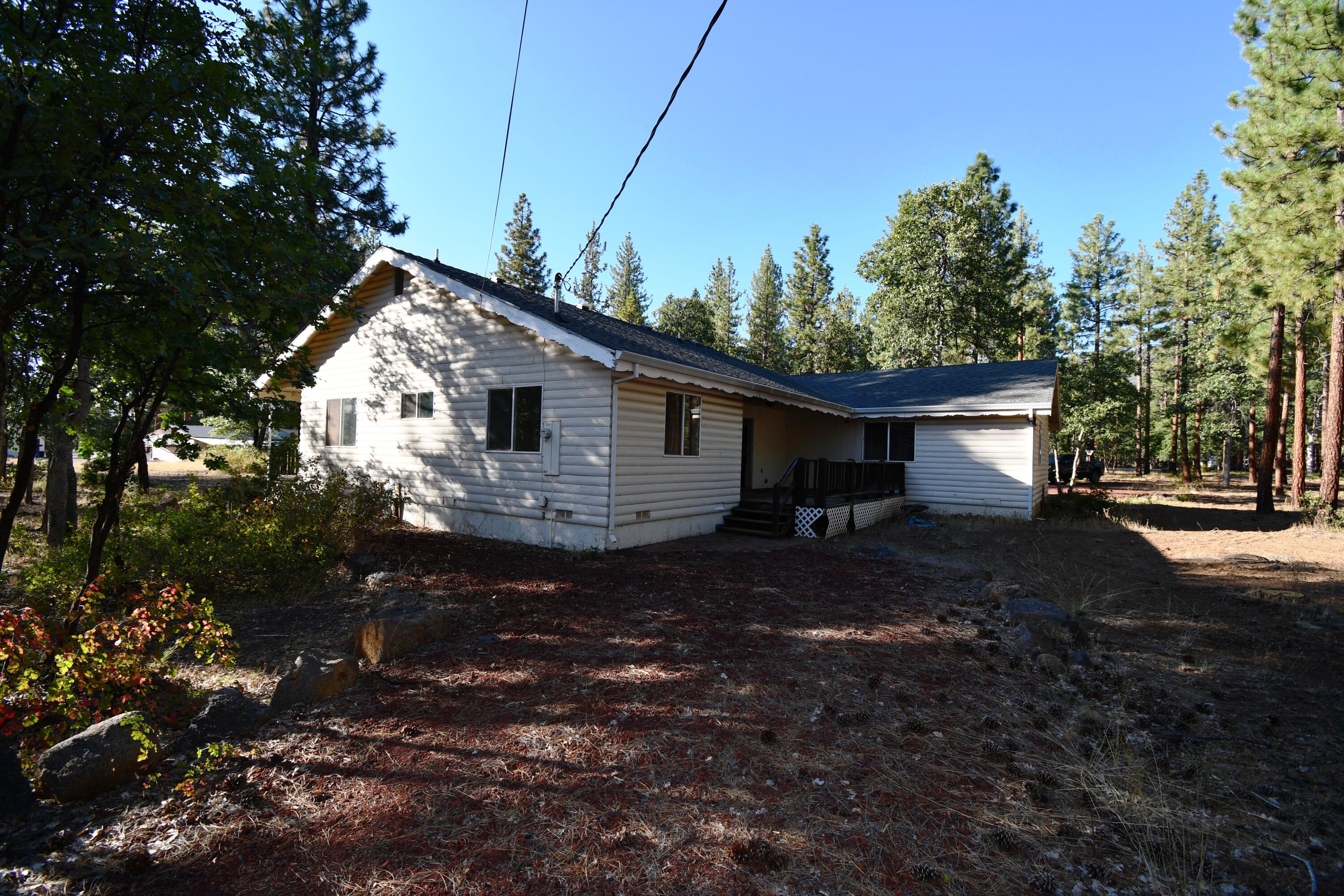 640-200 Iris Road McArthur, CA 96056 - Photo 3 of 48 a view of house with backyard space and garden