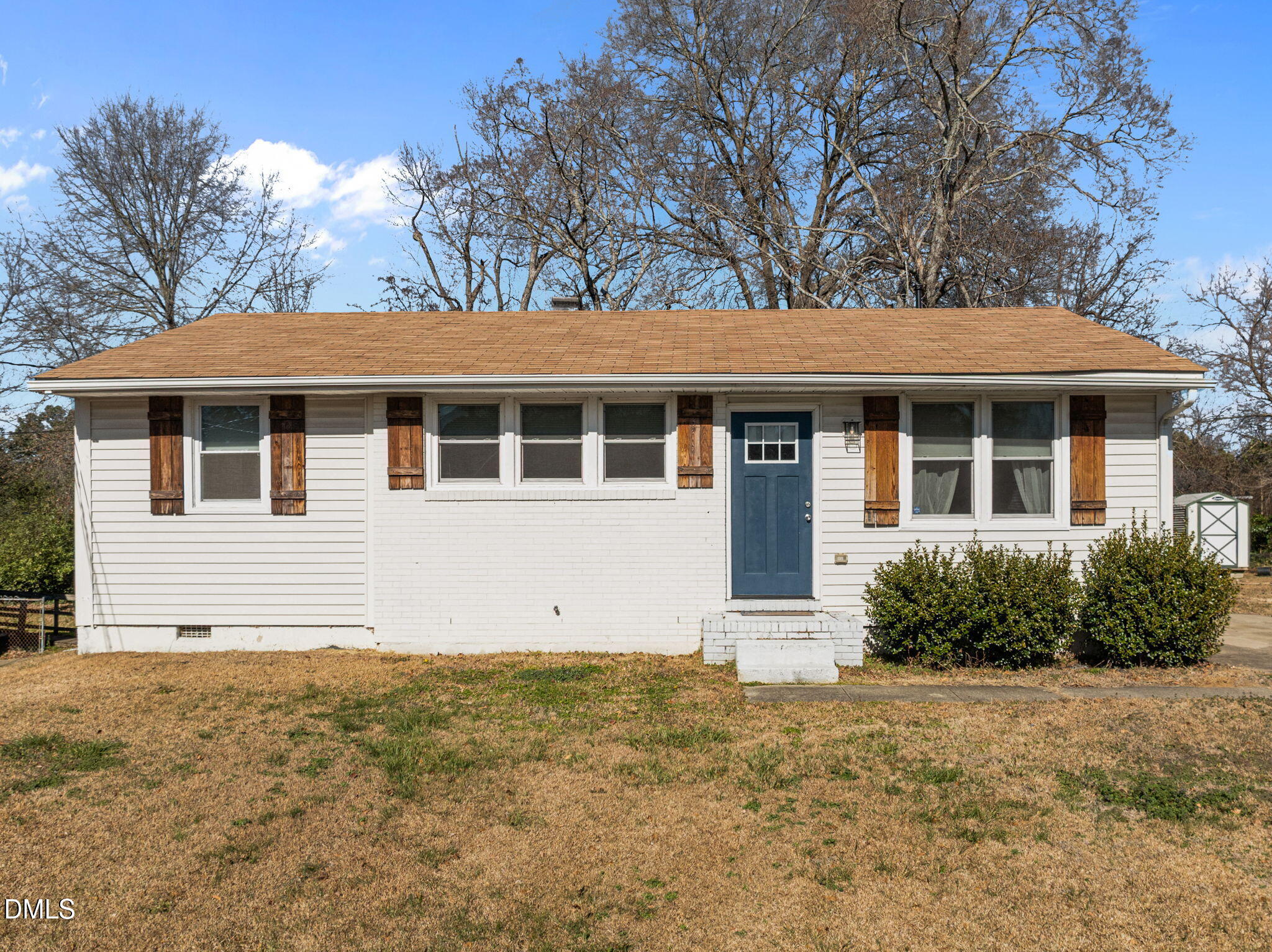 a house with trees in the background