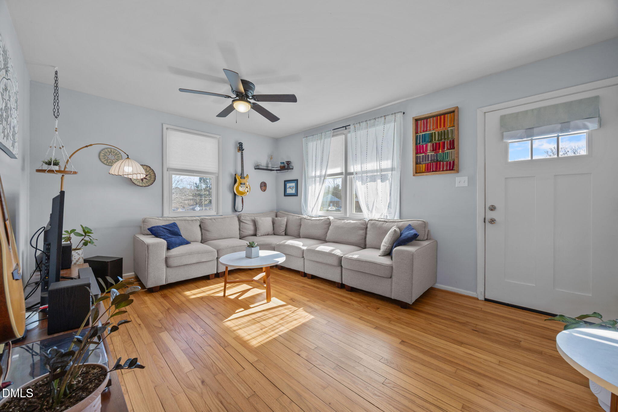823 Hadley Road Raleigh, NC 27610 - Photo 11 of 35 a living room with furniture and a wooden floor