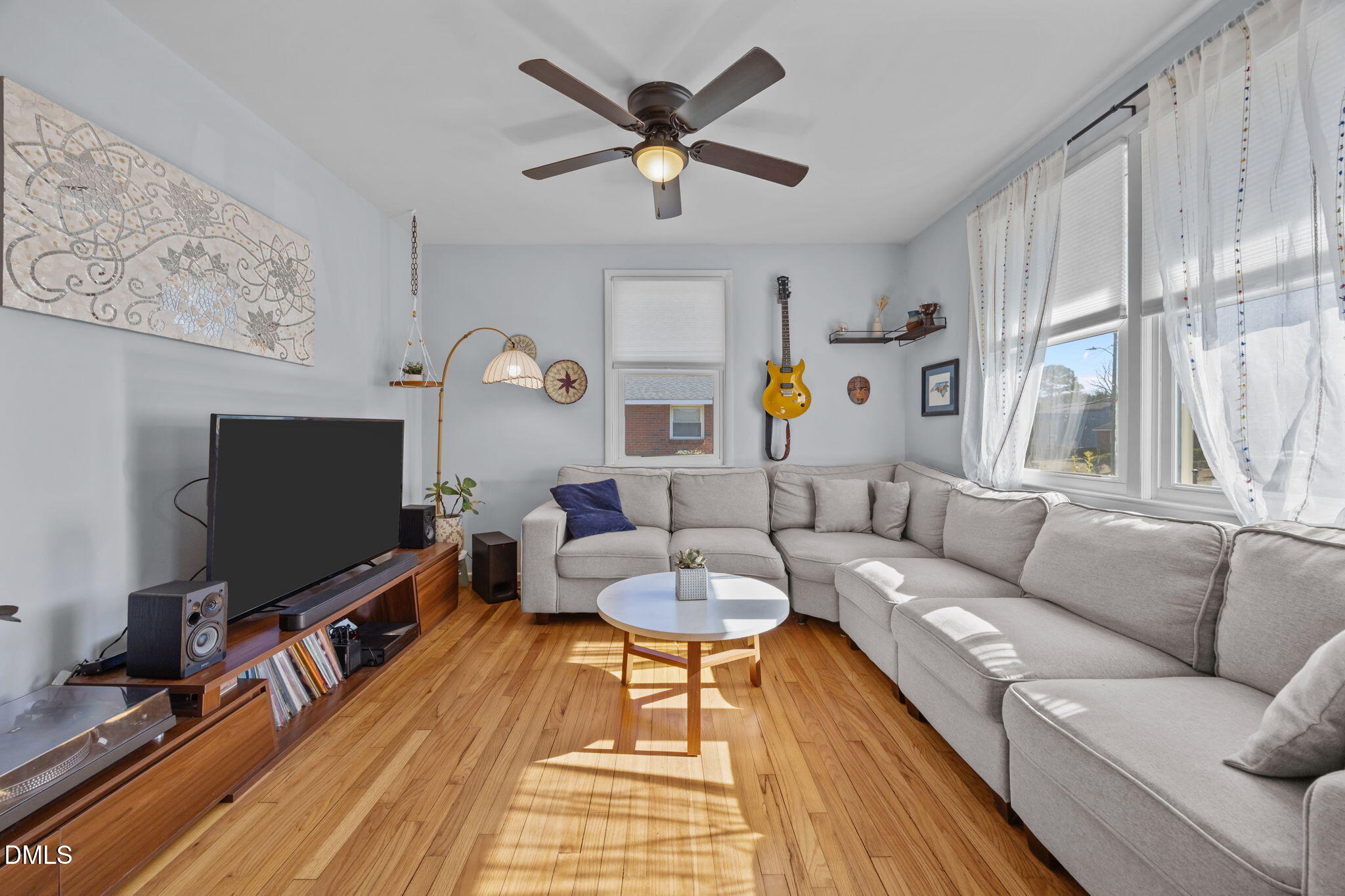 823 Hadley Road Raleigh, NC 27610 - Photo 13 of 35 a living room with furniture and a flat screen tv