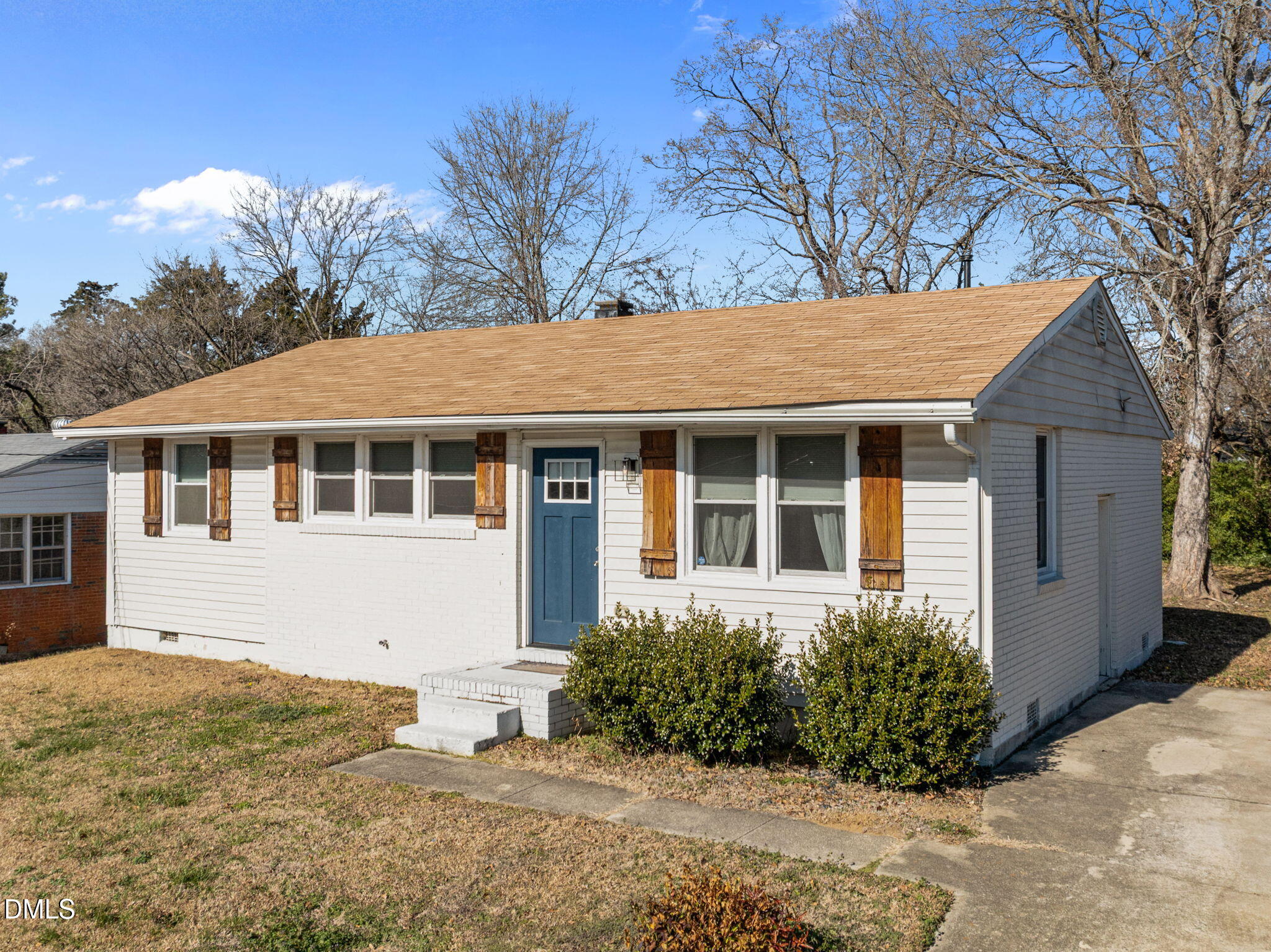 823 Hadley Road Raleigh, NC 27610 - Photo 2 of 35 a front view of a house with a garden