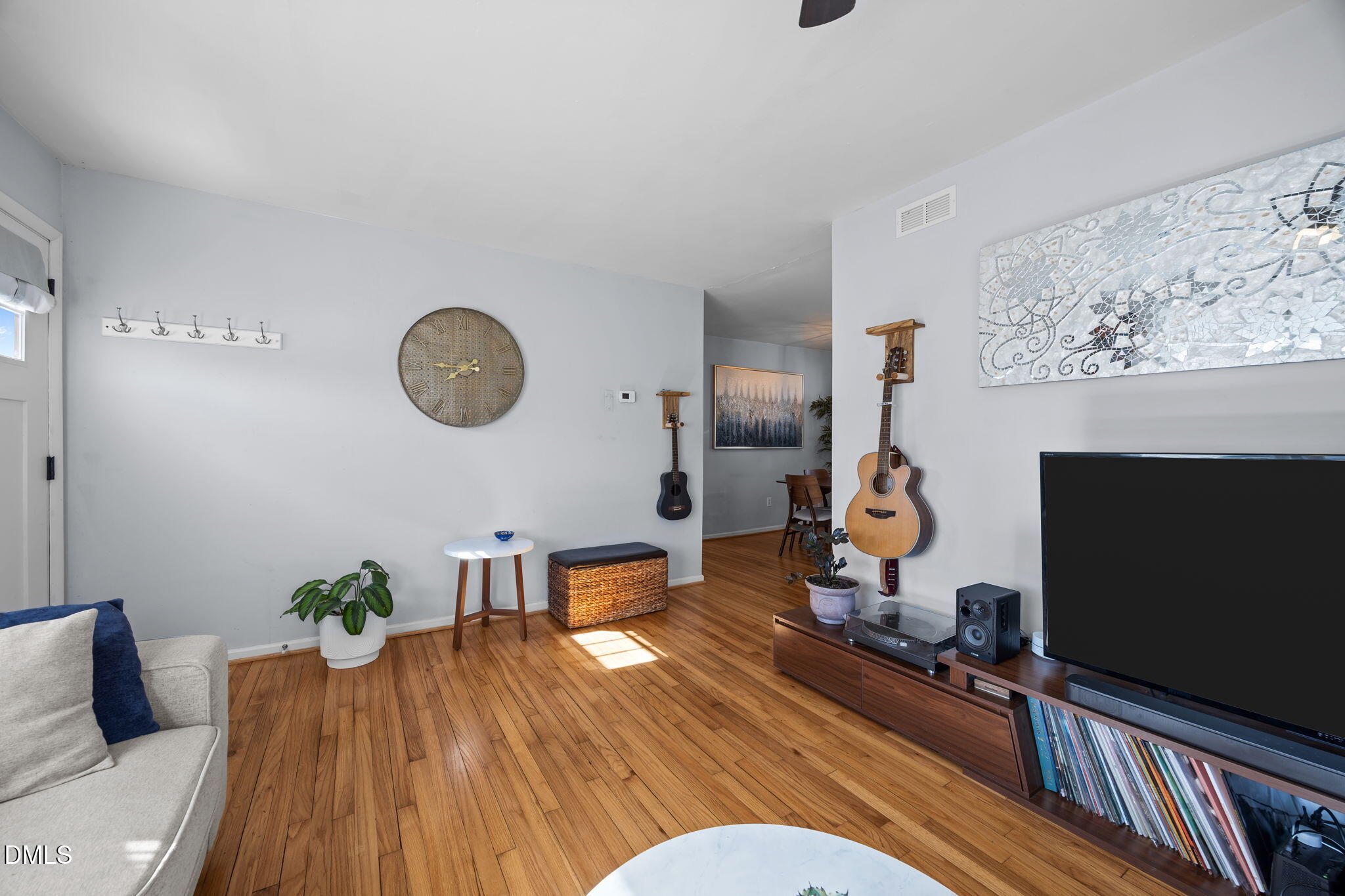823 Hadley Road Raleigh, NC 27610 - Photo 27 of 35 a living room with furniture and wooden floor