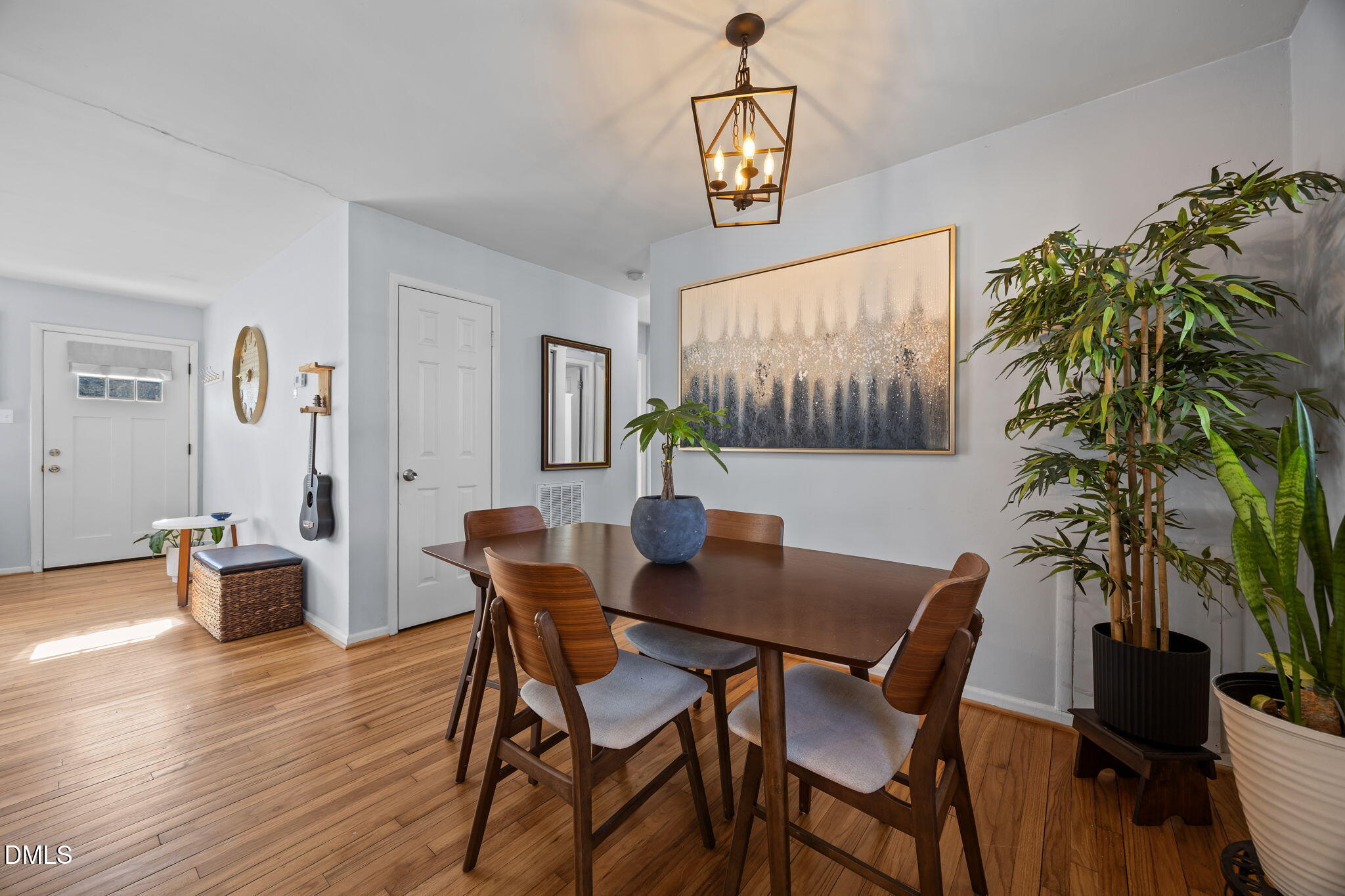 823 Hadley Road Raleigh, NC 27610 - Photo 28 of 35 a view of a dining room with furniture window and wooden floor