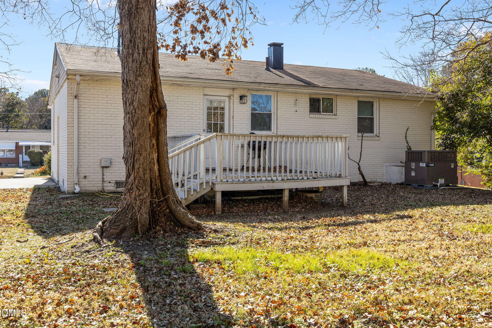 823 Hadley Road Raleigh, NC 27610 - Photo 31 of 35 a view of a house with a wooden deck