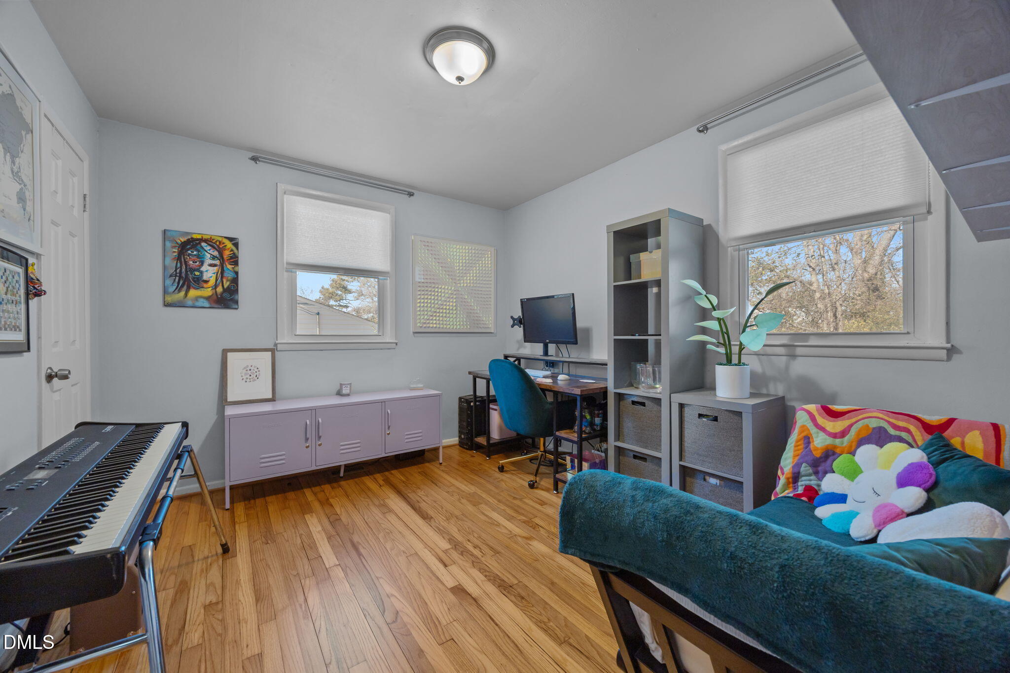 823 Hadley Road Raleigh, NC 27610 - Photo 4 of 35 a view of a workspace with furniture and a window