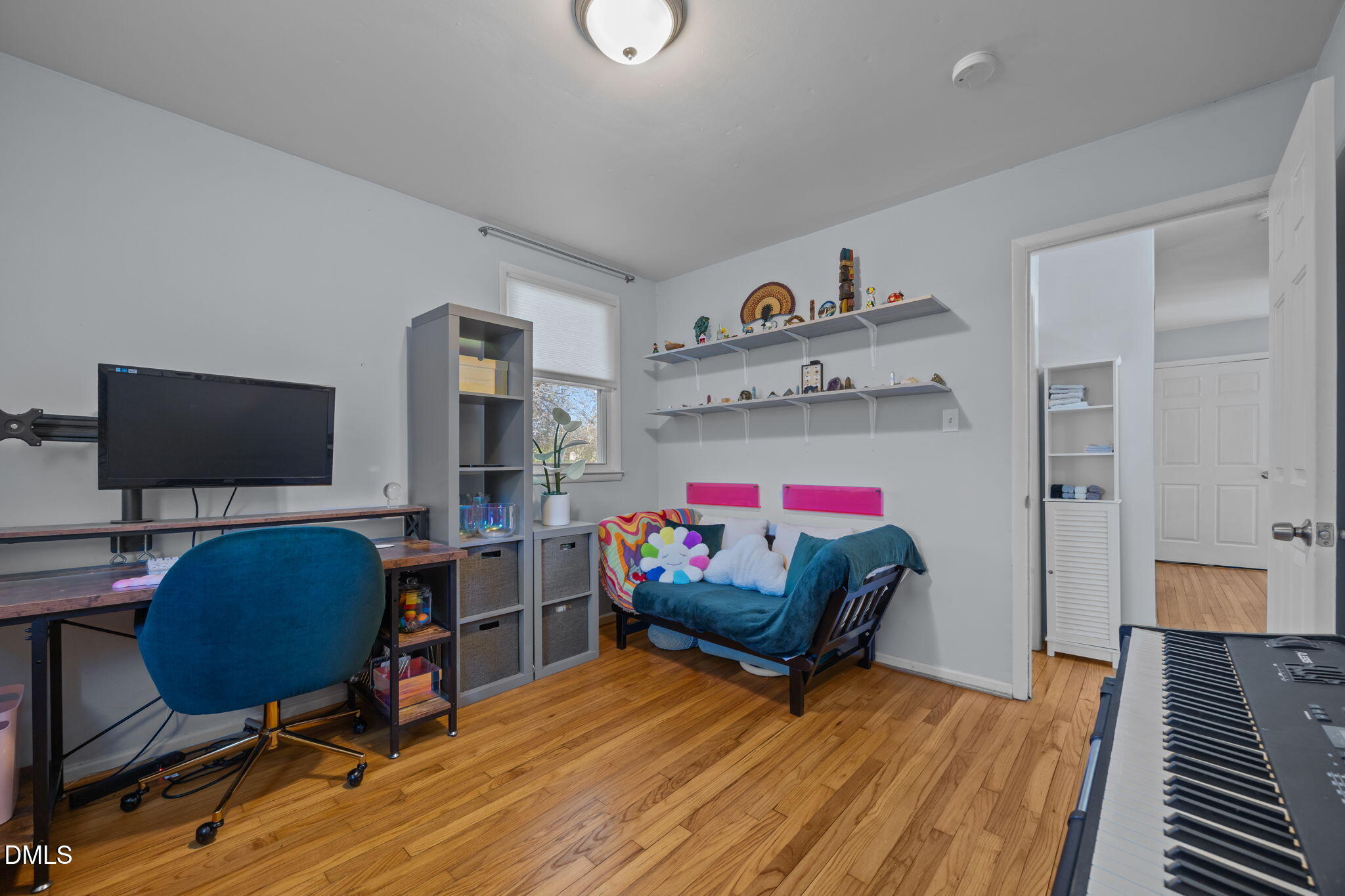 823 Hadley Road Raleigh, NC 27610 - Photo 5 of 35 a living room with furniture and a flat screen tv