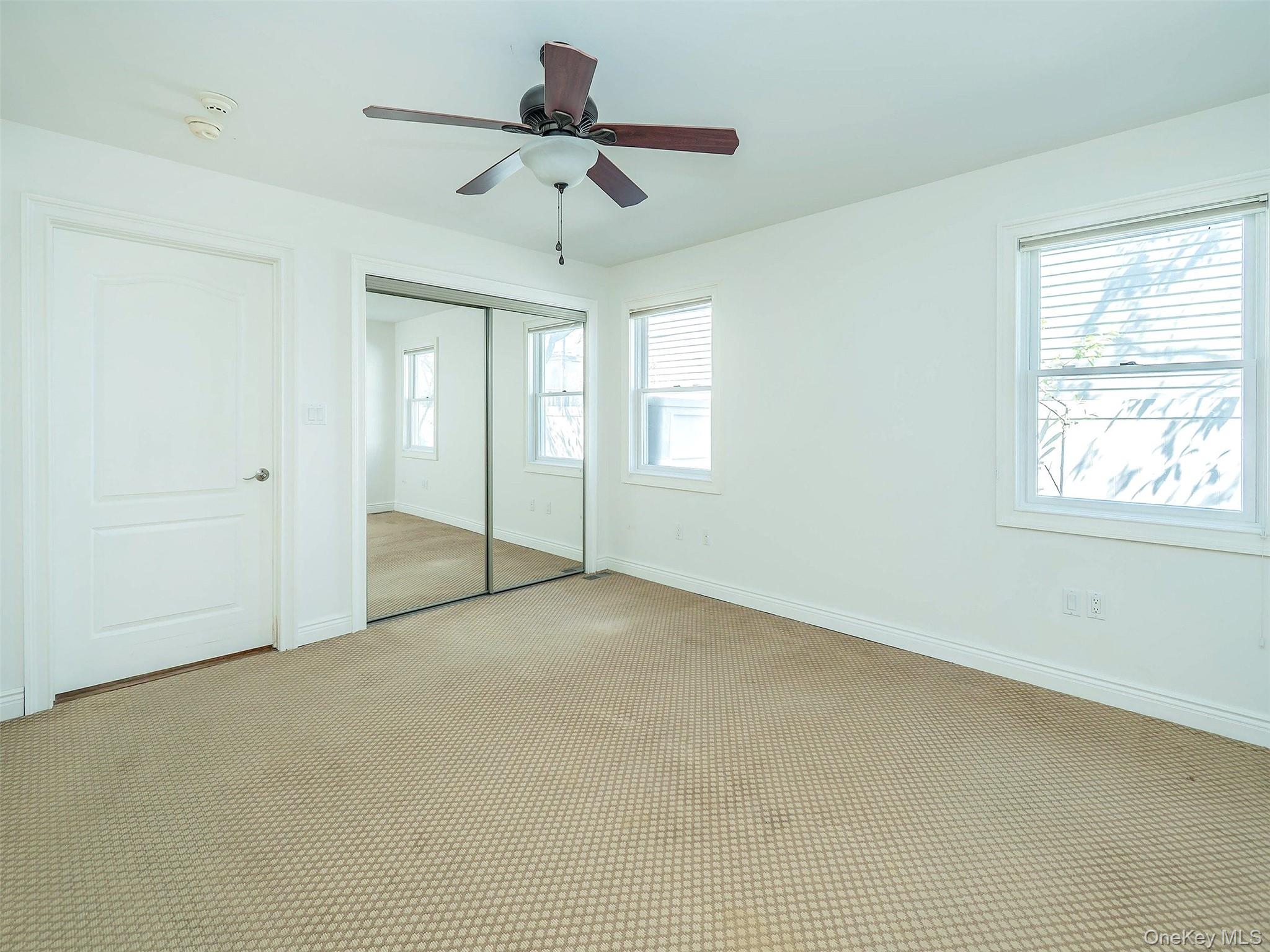 21 Marwood Road North Port Washington, NY 11050 - Photo 14 of 35 a view of an empty room with a window