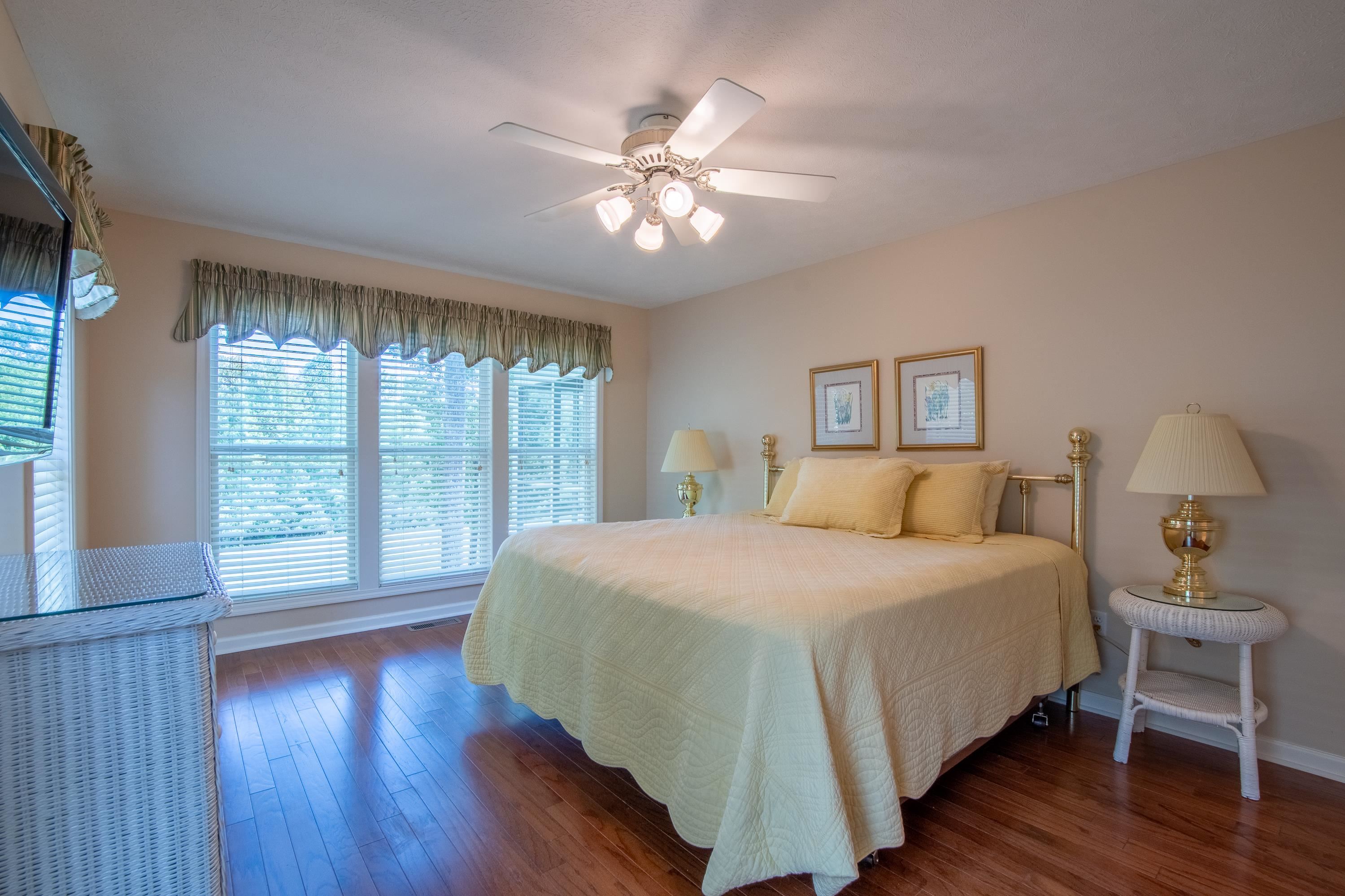 100 Vantage Pointe Counce, TN 38326 - Photo 11 of 33 a bedroom with a large bed and a chandelier
