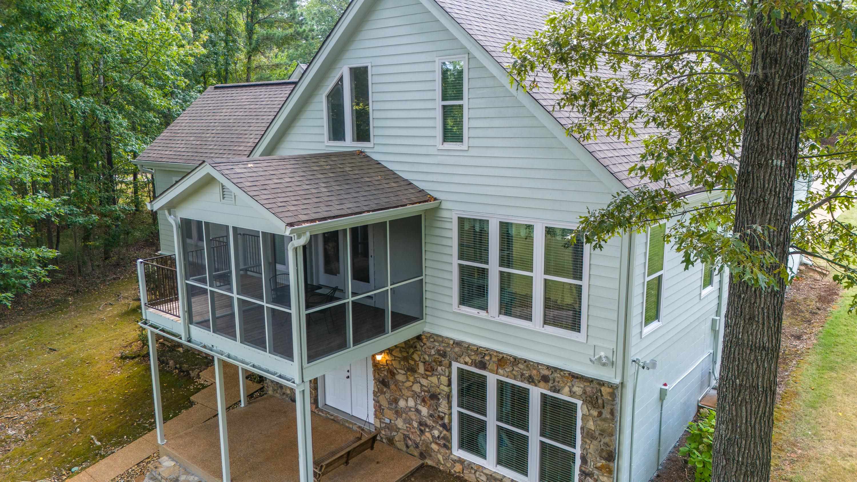 100 Vantage Pointe Counce, TN 38326 - Photo 14 of 33 Rear view of property with a patio area and a sunroom