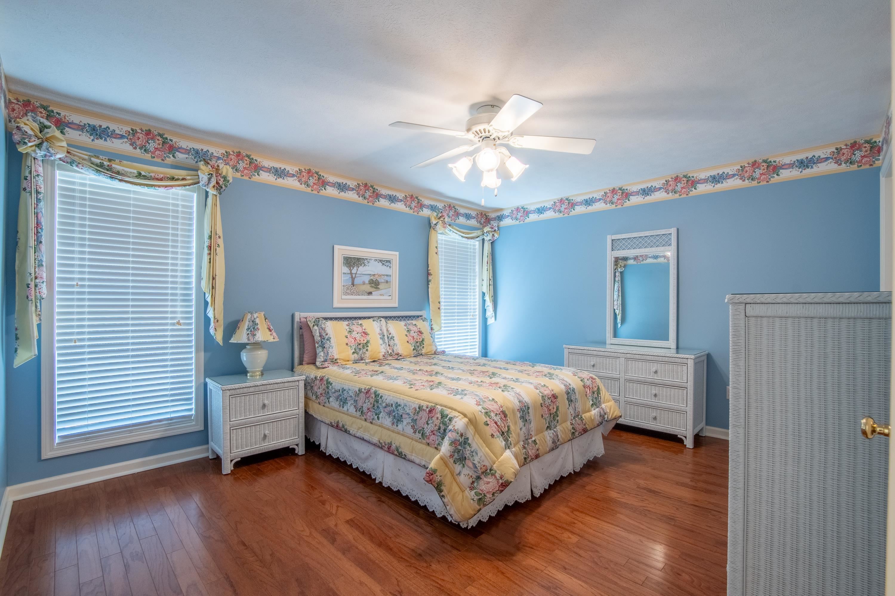 100 Vantage Pointe Counce, TN 38326 - Photo 17 of 33 a bedroom with a bed and a chandelier