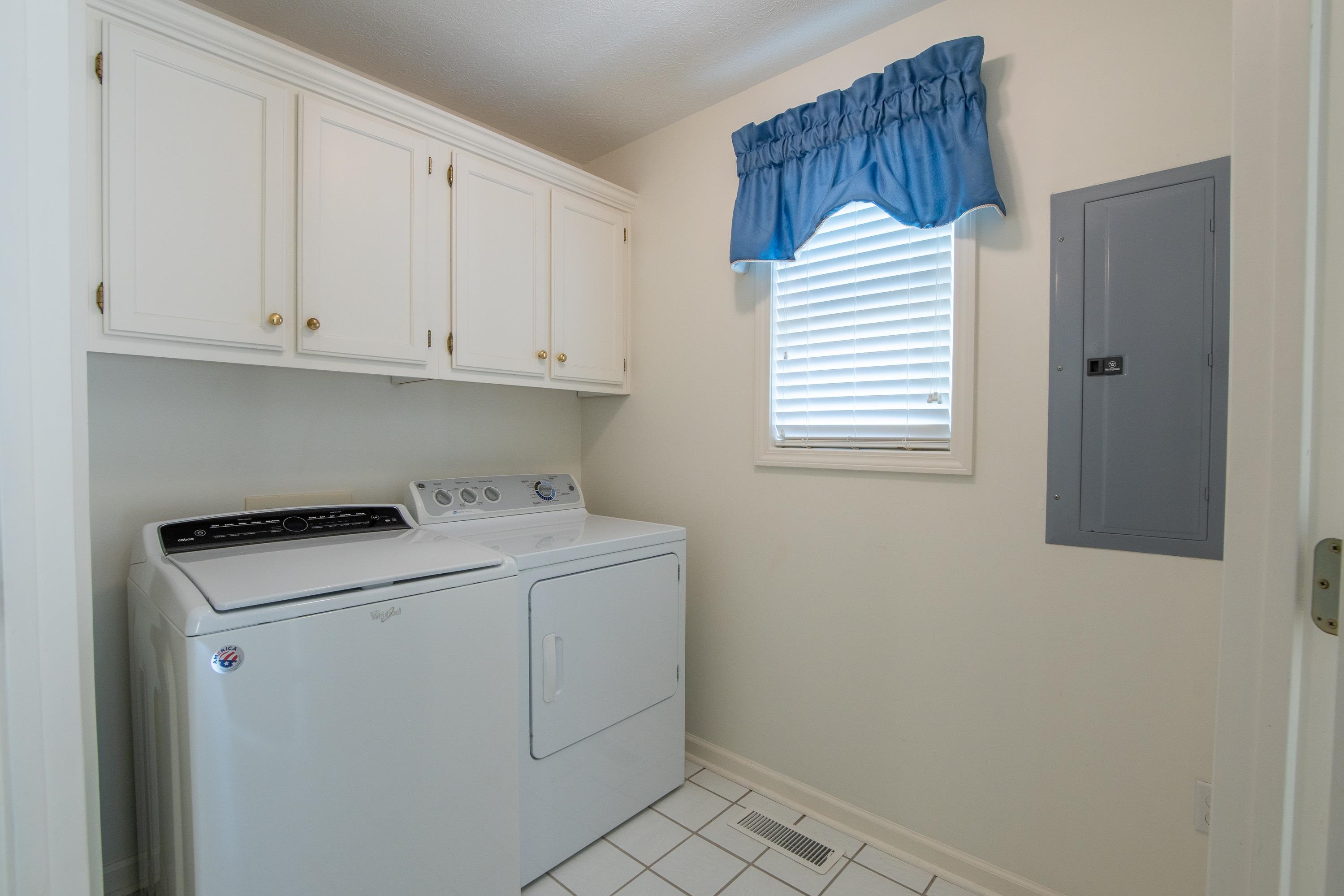 100 Vantage Pointe Counce, TN 38326 - Photo 33 of 33 Laundry room with light tile patterned flooring, independent washer and dryer, cabinets, and electric panel