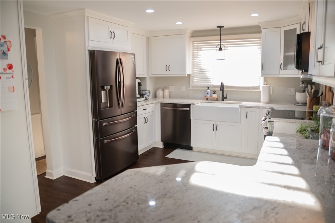 95 Clingan Road Struthers, OH 44471 - Photo 22 of 46 Kitchen with light stone counters, stainless steel appliances, white cabinetry, pendant lighting, and recessed lighting