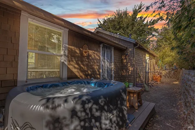 a view of backyard with cabin