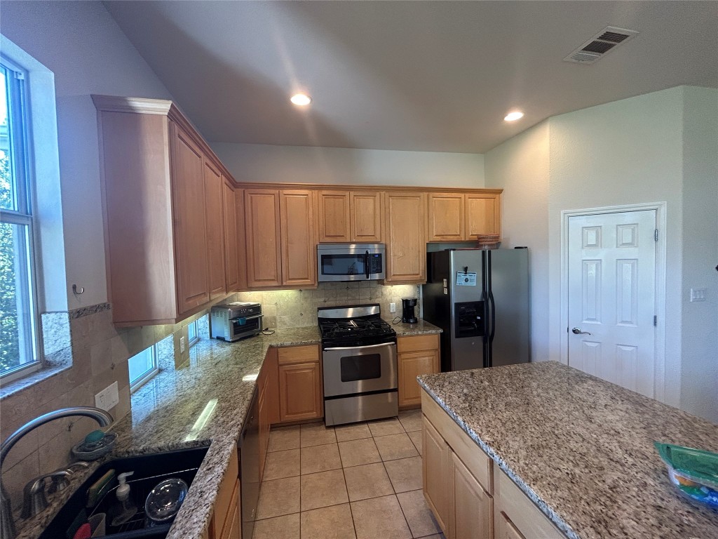 6705 Fort Davis Cove, Unit A Austin, TX 78731 - Photo 9 of 23 Gas Range, Microwave and Refrigerator are provided