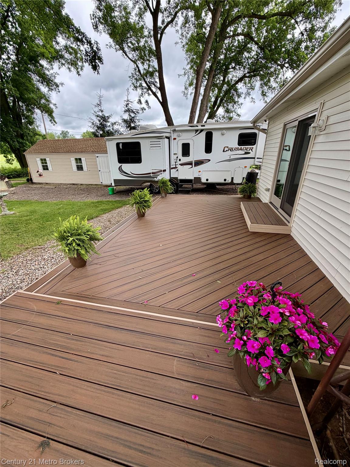 3259 North Seymour Road Flushing, MI 48433 - Photo 7 of 49 Spacious composite deck with multi-directional planking and integrated steps