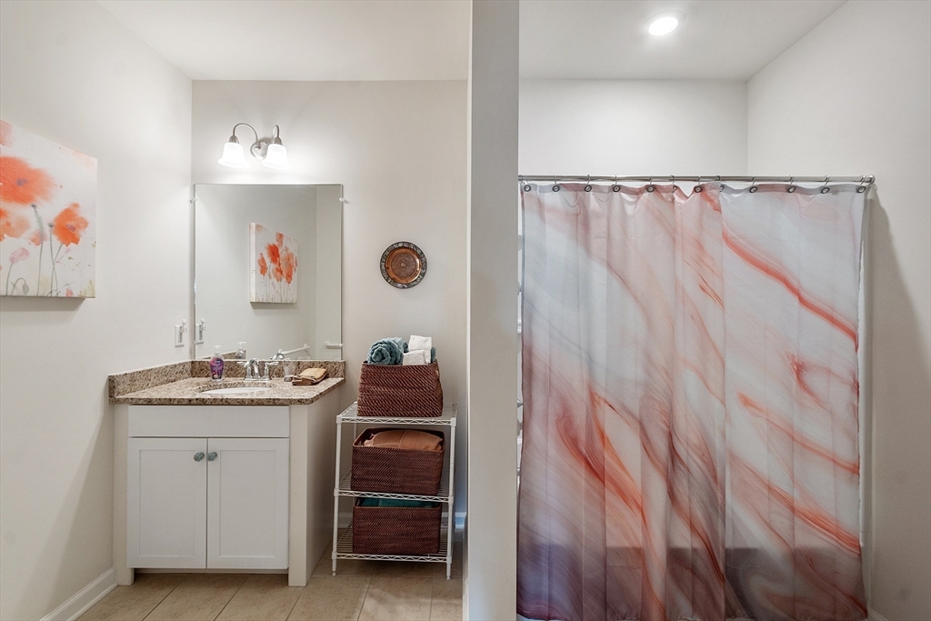2 Francis Drive, Unit 412 Andover, MA 01810 - Photo 21 of 33 a utility room with a sink and cabinets