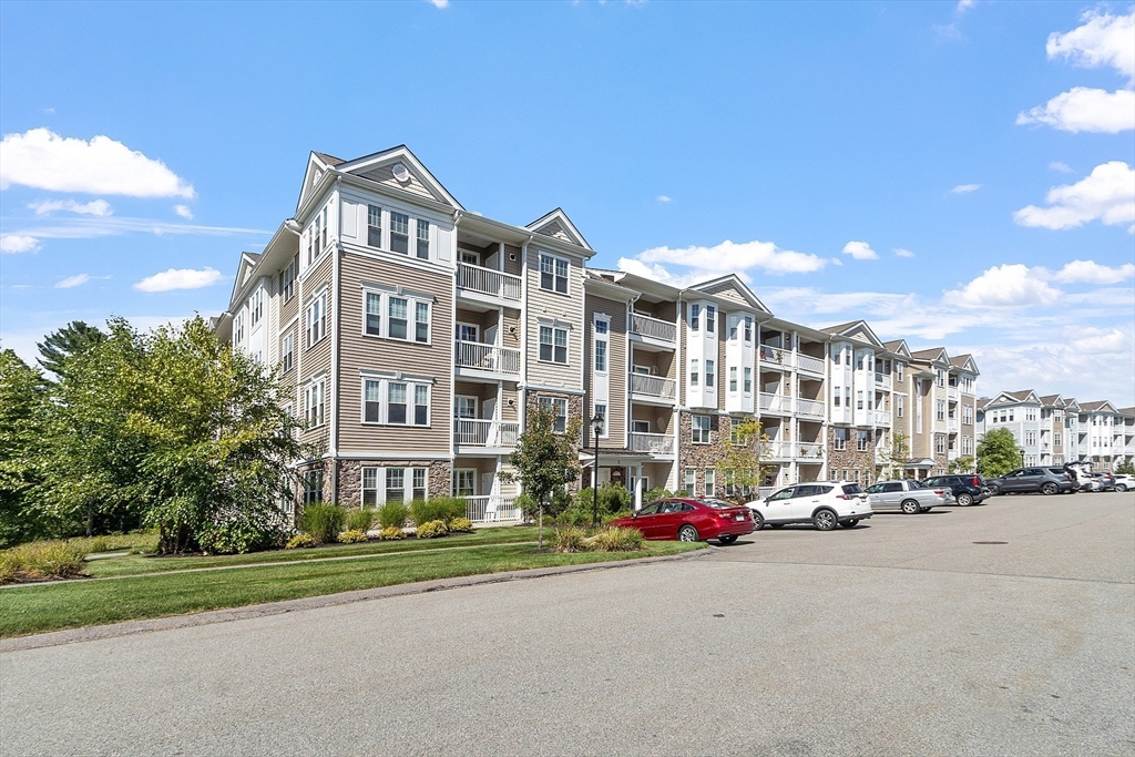 2 Francis Drive, Unit 412 Andover, MA 01810 - Photo 33 of 33 a city street lined with buildings and trees