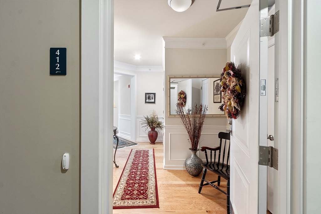 2 Francis Drive, Unit 412 Andover, MA 01810 - Photo 6 of 33 a very nice looking room with a carpet