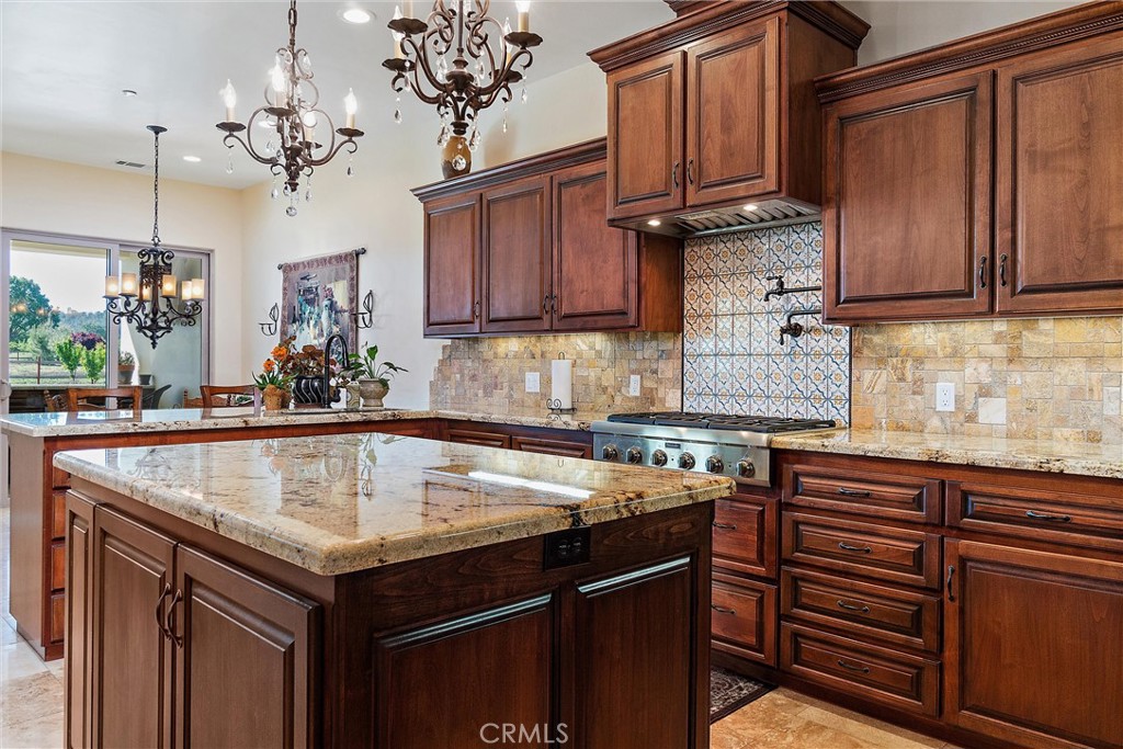 18205 Walnut Avenue Atascadero, CA 93422 - Photo 12 of 46 a kitchen with granite countertop a sink and cabinets