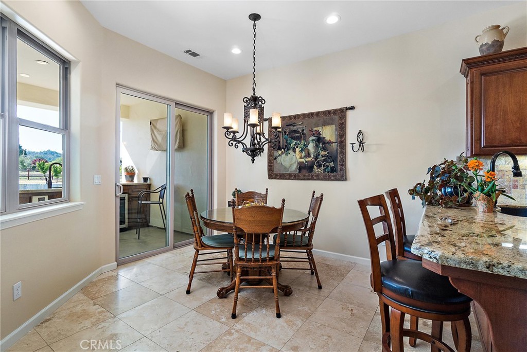 18205 Walnut Avenue Atascadero, CA 93422 - Photo 13 of 46 a dining room with furniture a chandelier and window