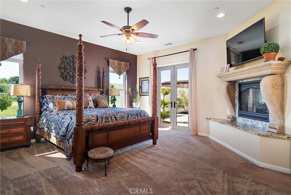 18205 Walnut Avenue Atascadero, CA 93422 - Photo 14 of 46 a bedroom with a bed and a flat screen tv